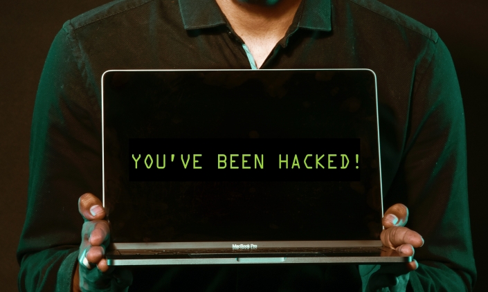 man-holding-laptop-computer-with-both-hands-2036656