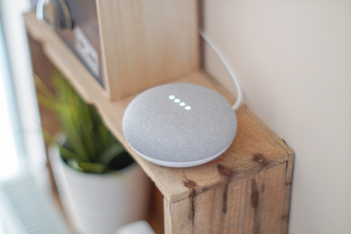round-grey-speaker-on-brown-board-1072851 (1)